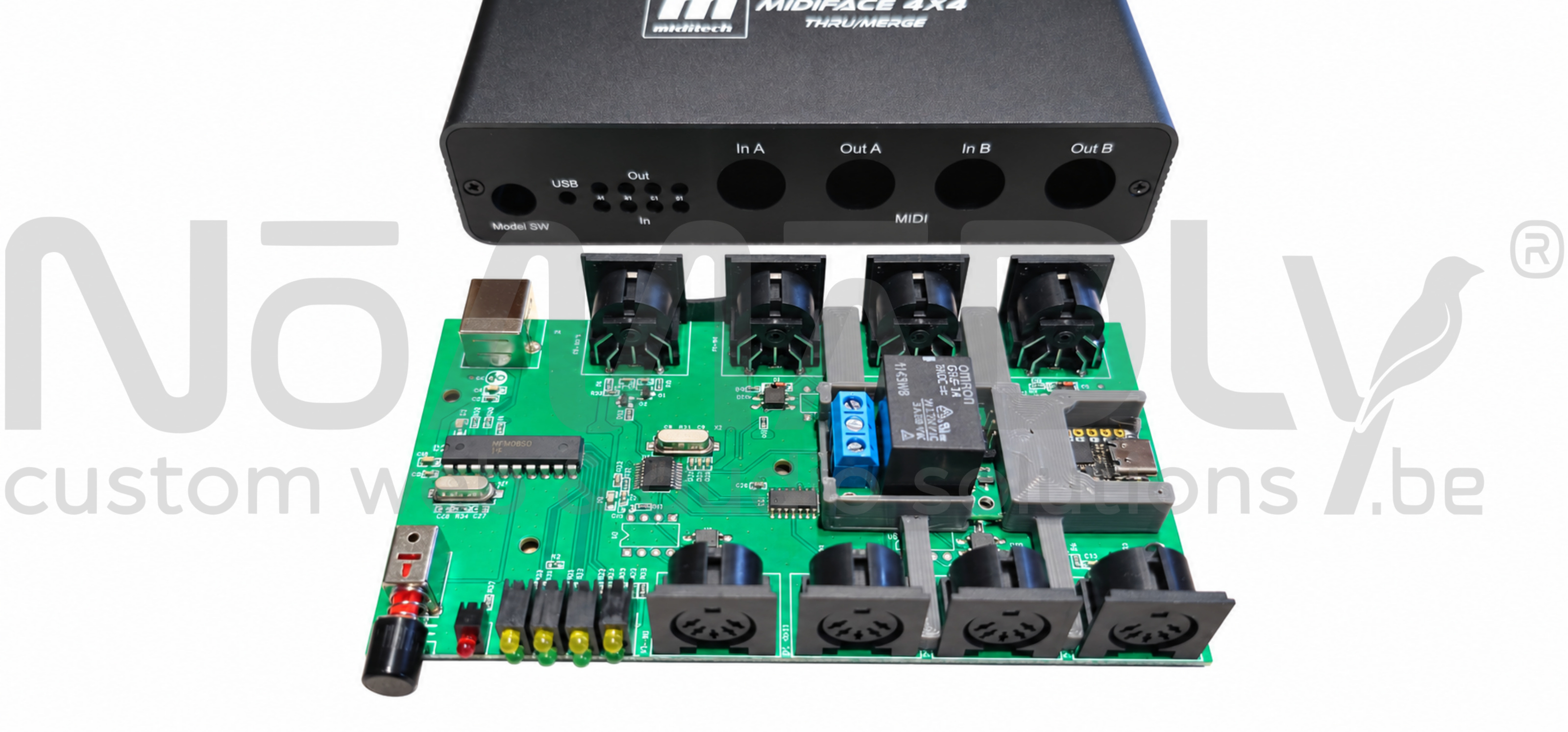 Midiface board removed from its enclosure, with the grey 3D printed support, relay and QT Py in place.